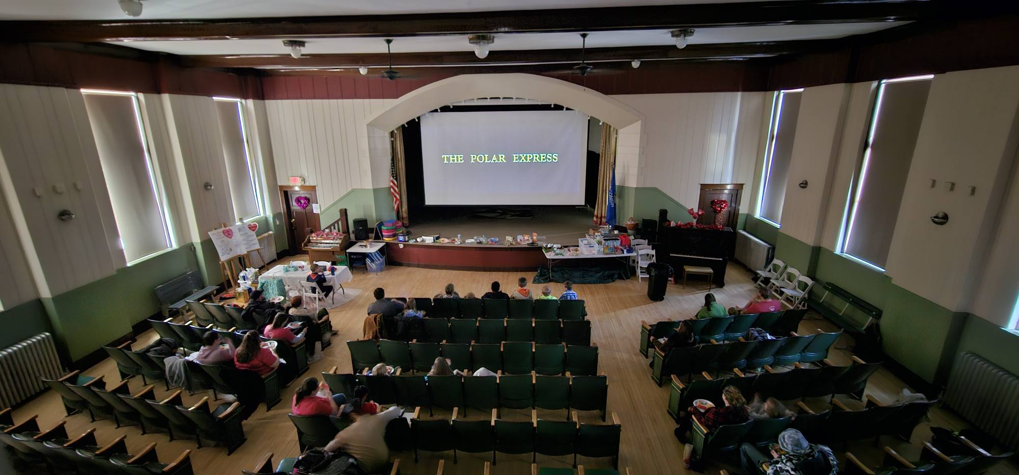 Photo of the Cap'n Seabeard band playing on a stage in the Colfax Municipal Building.